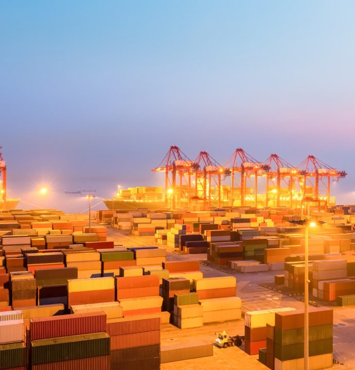 container wharf in nightfall, international import and export trade background