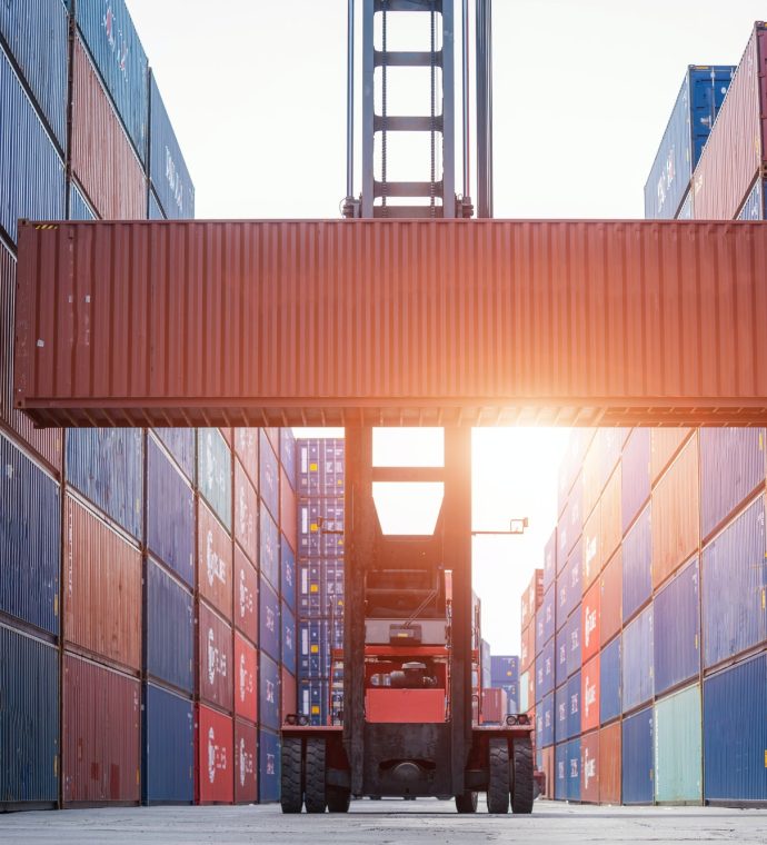 Forklift working in the container cargo yard port loading cargo, Logistic service and transportation